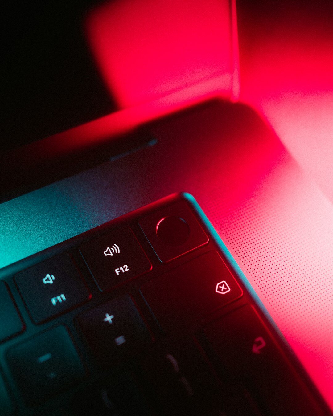 Close up of developer hands typing code on a laptop keyboard