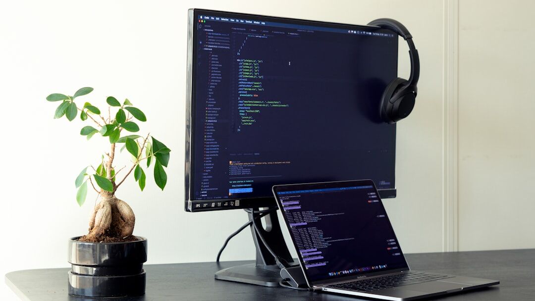 Security analyst monitoring code and dashboards on multiple screens