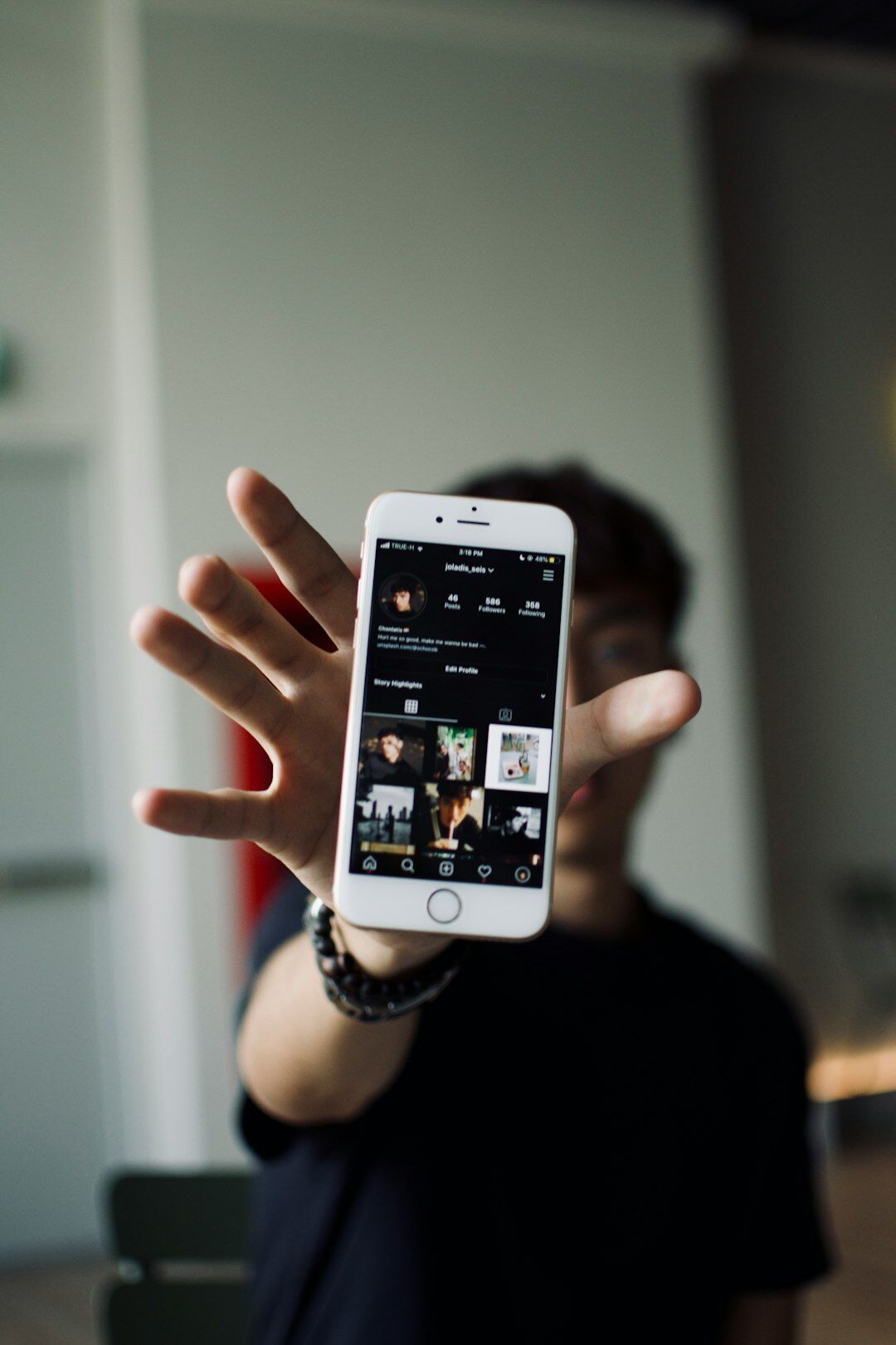Person testing a mobile application on a smartphone